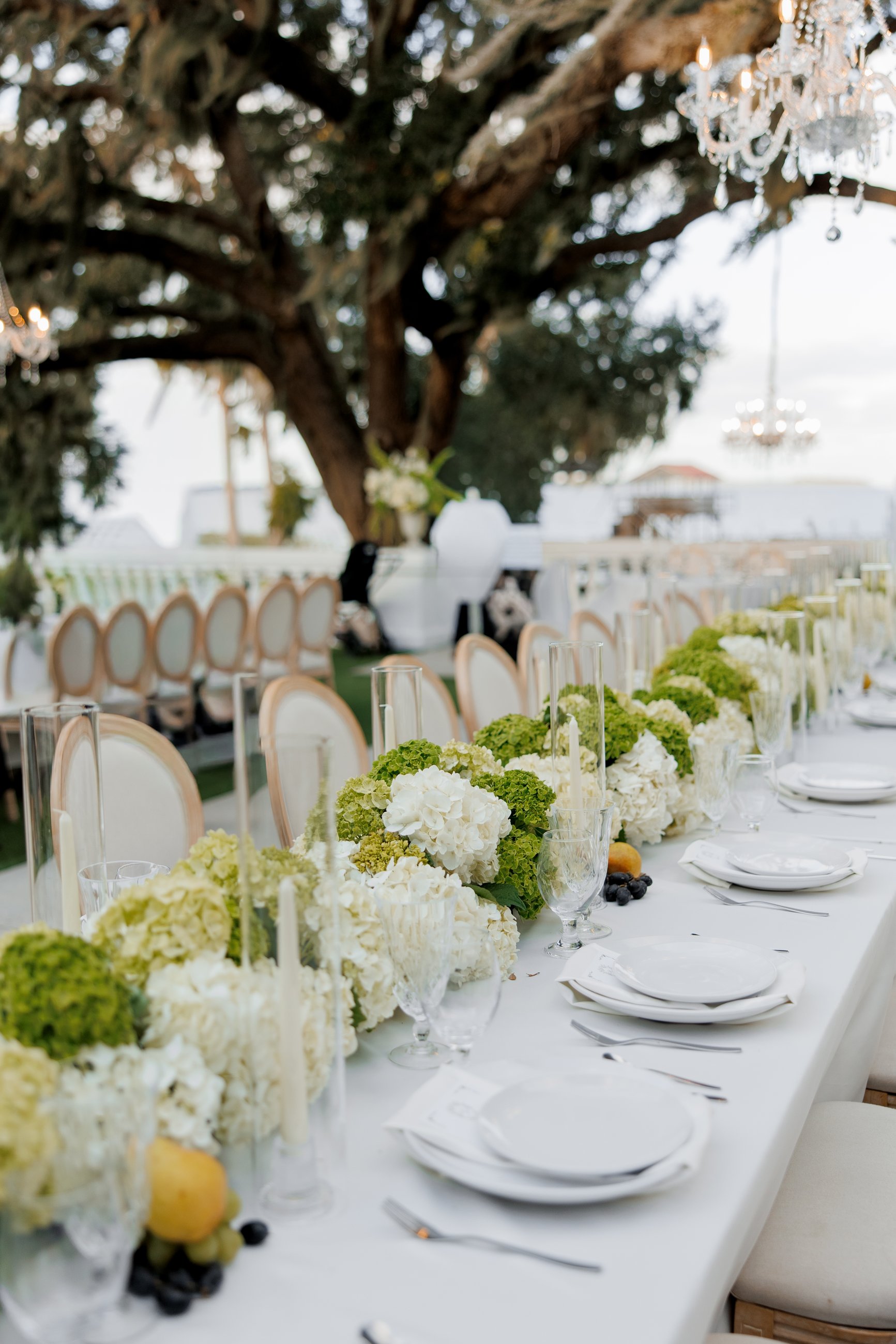 White floral ceremony arch in soft light